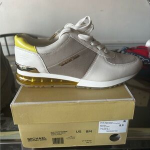 MK sneakers. Yellow, white, and gold